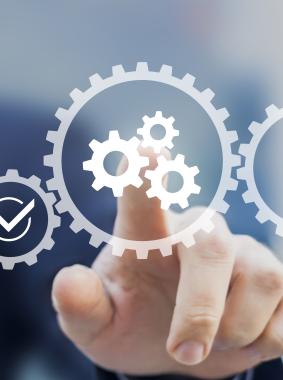 A hand selecting overlaid cogs